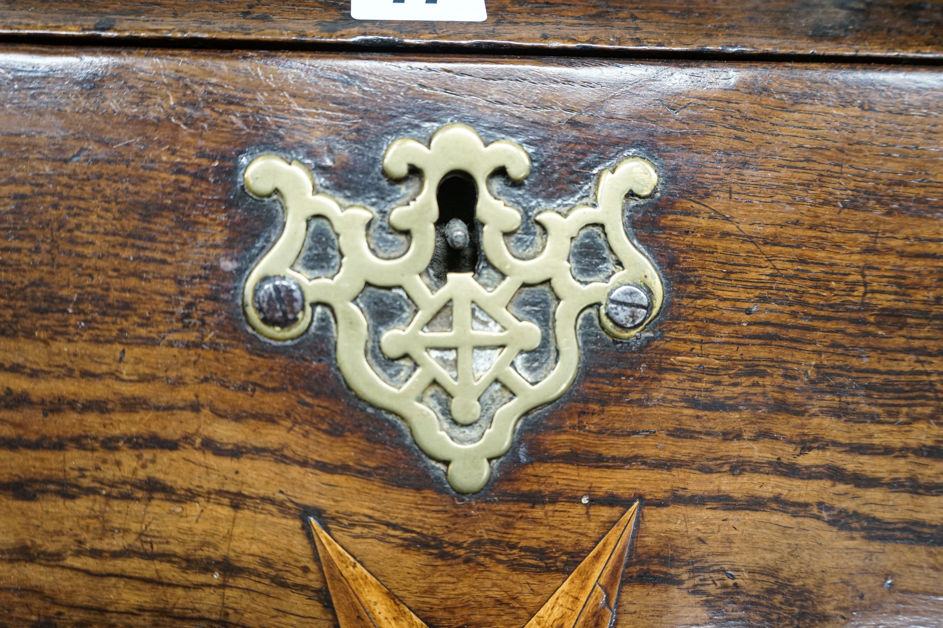 A mid 18th century inlaid oak and elm bureau, with fitted interior and single drawer, width 77cm, depth 45cm, height 94cm